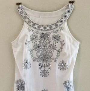 White dress with black detailing.